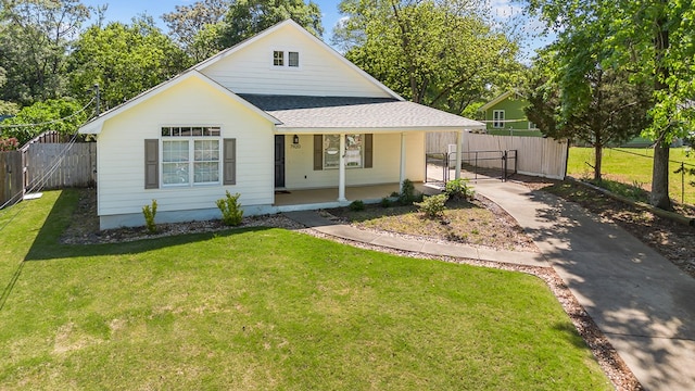 bungalow with a gate, fence, a shingled roof, a front lawn, and a porch