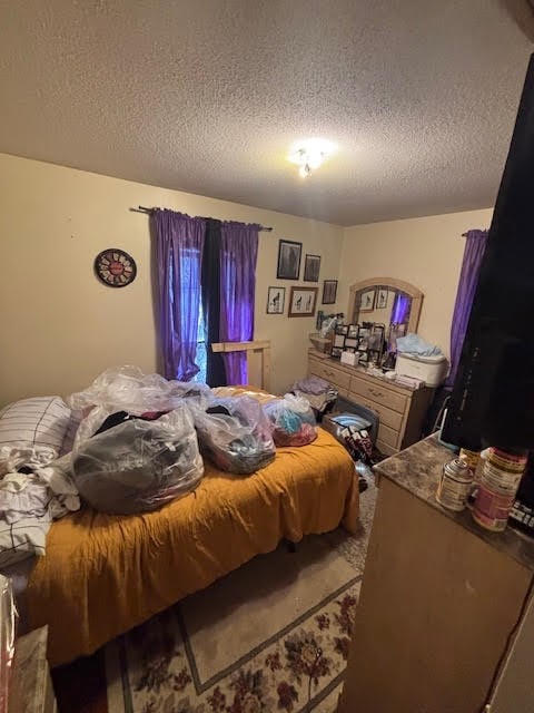 bedroom with a textured ceiling