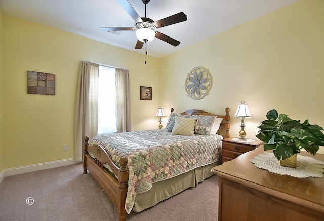 bedroom with light carpet and ceiling fan