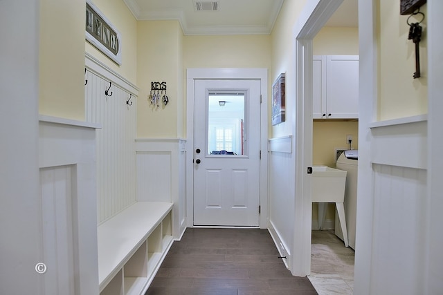 mudroom with ornamental molding and dark wood-type flooring