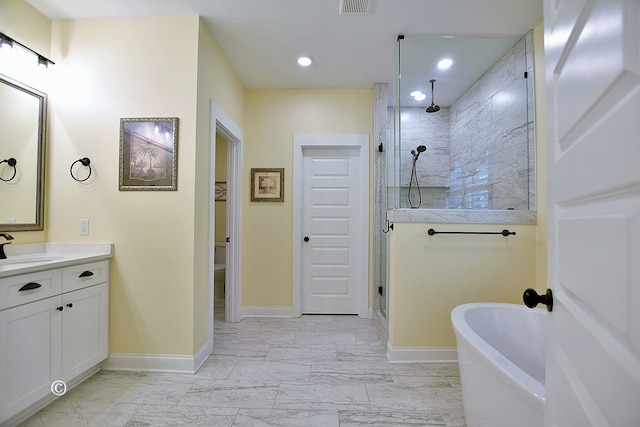 bathroom with separate shower and tub and vanity