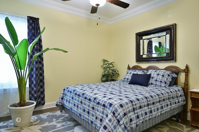 bedroom with wood-type flooring, ceiling fan, and ornamental molding