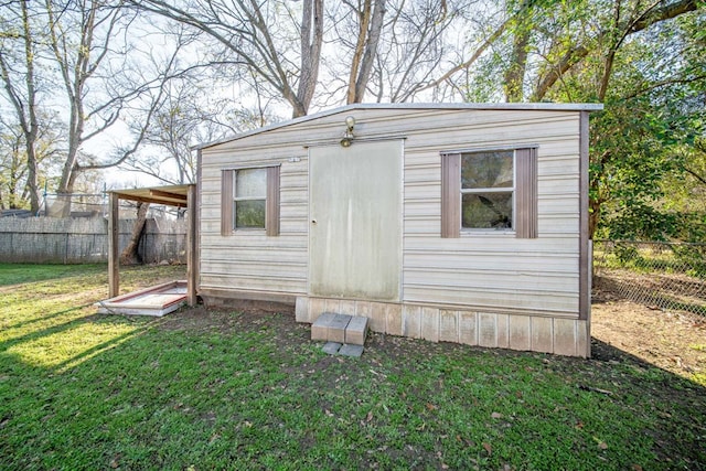 view of outdoor structure with an outbuilding and a fenced backyard