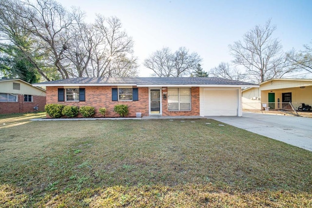 ranch-style home with brick siding, driveway, a front lawn, and an attached garage