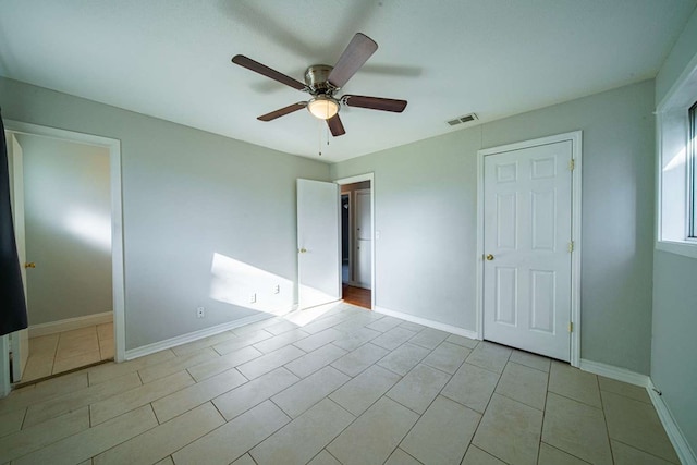 unfurnished bedroom featuring visible vents, ceiling fan, and baseboards