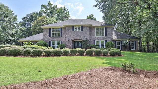 colonial inspired home with a front yard