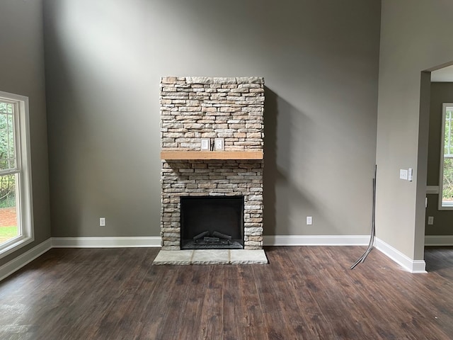 3077 Reese Rd, Columbus, GA 31907 - unfurnished living room with wood finished floors and a stone fireplace