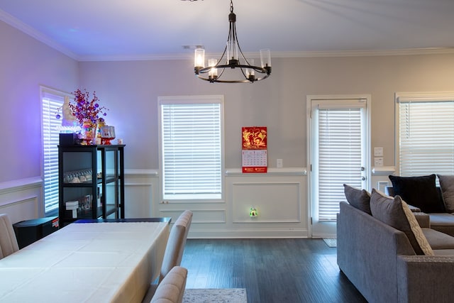 6845 Admiral Dr, Midland, GA 31820 - dining area featuring crown molding, dark wood finished floors, visible vents, wainscoting, and a notable chandelier