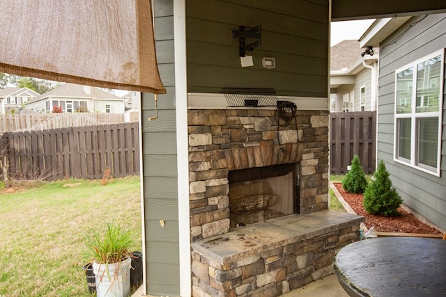 6845 Admiral Dr, Midland, GA 31820 - view of patio / terrace featuring fence and an outdoor stone fireplace