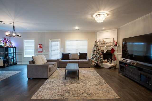 6845 Admiral Dr, Midland, GA 31820 - living room with crown molding, a chandelier, and dark wood finished floors