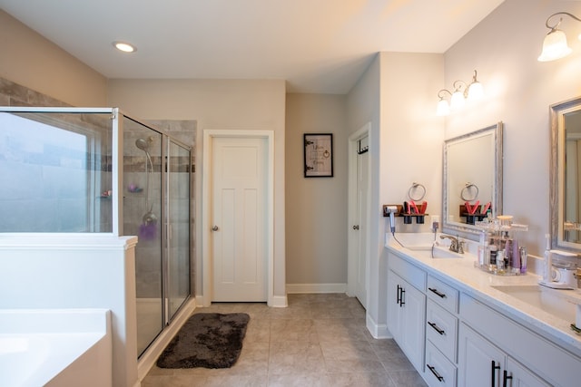 6845 Admiral Dr, Midland, GA 31820 - bathroom featuring a shower stall, double vanity, and a sink