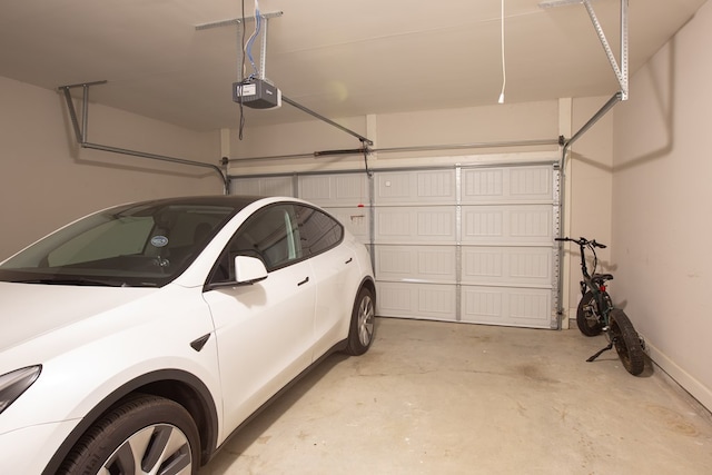 6845 Admiral Dr, Midland, GA 31820 - garage with baseboards and a garage door opener