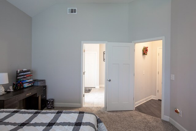 6845 Admiral Dr, Midland, GA 31820 - carpeted bedroom featuring high vaulted ceiling, visible vents, and baseboards