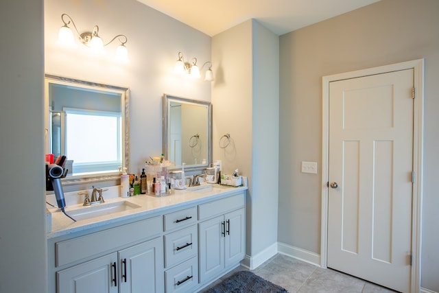 6845 Admiral Dr, Midland, GA 31820 - bathroom featuring double vanity, a sink, tile patterned flooring, and baseboards
