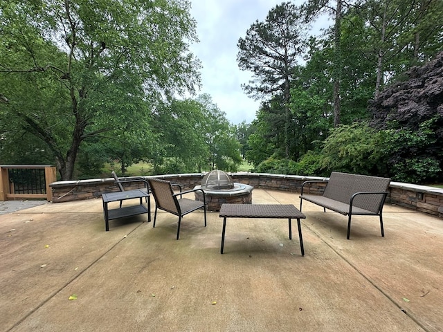 view of patio featuring an outdoor fire pit