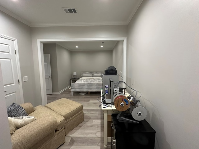bedroom with visible vents, crown molding, baseboards, light wood-style floors, and recessed lighting
