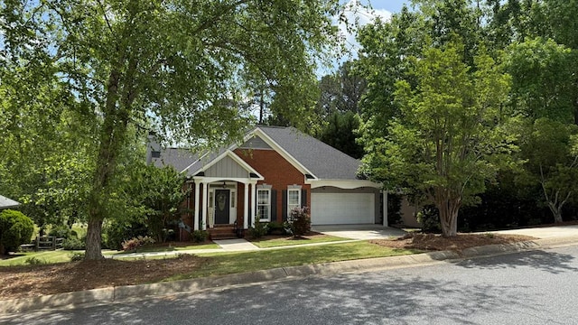 view of front of home with a garage, roof with shingles, a chimney, and concrete driveway