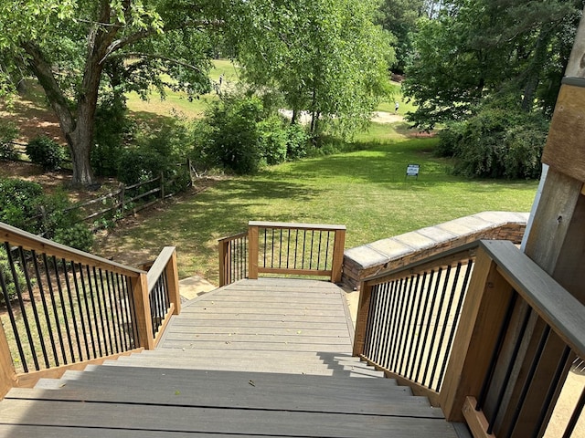 wooden deck with fence and a yard