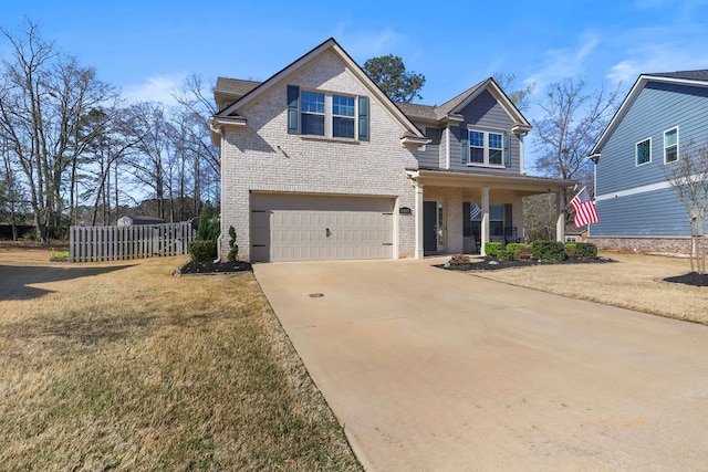 view of front of house featuring brick siding, concrete driveway, a front yard, covered porch, and a garage