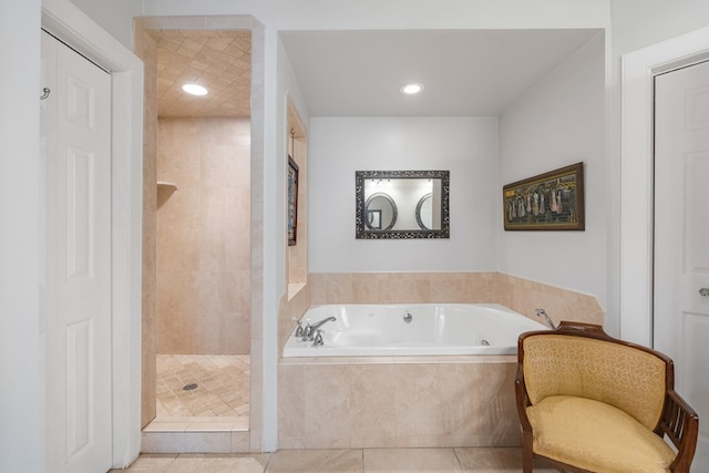 bathroom with tile patterned floors and plus walk in shower