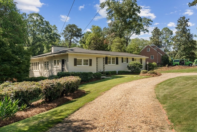 ranch-style house with a front yard