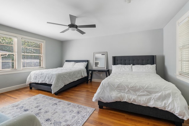 bedroom featuring ceiling fan and wood-type flooring