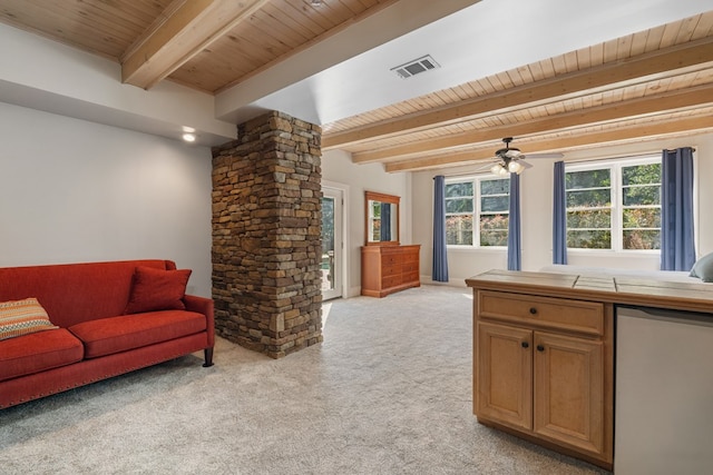 living room with ceiling fan, beamed ceiling, light colored carpet, and wooden ceiling