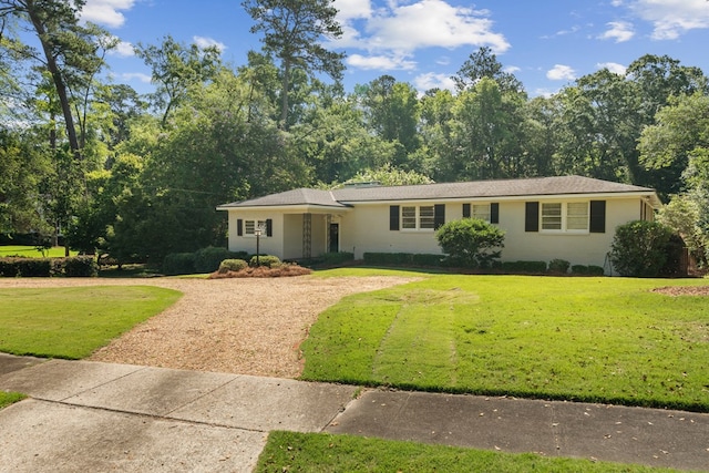 ranch-style house with a front lawn