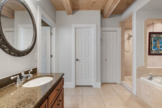 bathroom with tile patterned flooring, beamed ceiling, vanity, and wooden ceiling