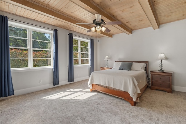 bedroom with multiple windows, light carpet, and ceiling fan