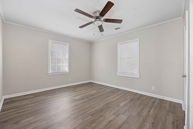 unfurnished room with dark hardwood / wood-style floors, ceiling fan, and crown molding