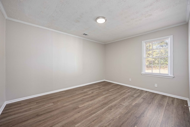 unfurnished room featuring hardwood / wood-style flooring, crown molding, and a textured ceiling