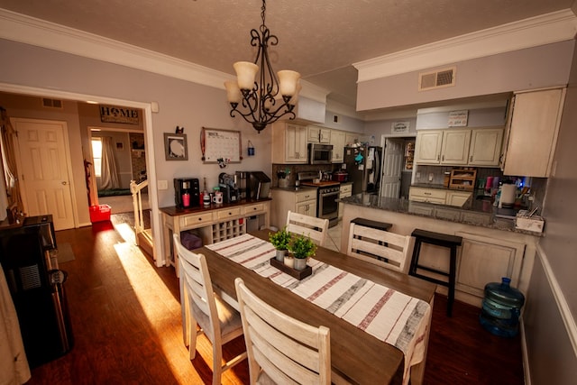 dining space with an inviting chandelier, visible vents, dark wood finished floors, and crown molding