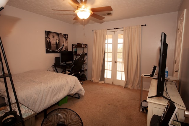 carpeted bedroom with ceiling fan, visible vents, a textured ceiling, and french doors