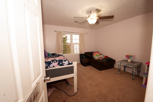 bedroom featuring a textured ceiling, carpet floors, ceiling fan, and visible vents