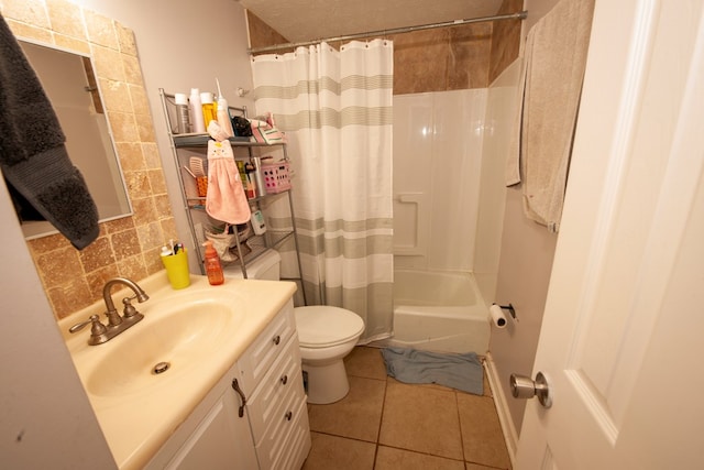 full bath featuring shower / bath combo, decorative backsplash, toilet, tile patterned floors, and vanity