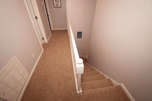 staircase with carpet flooring and baseboards