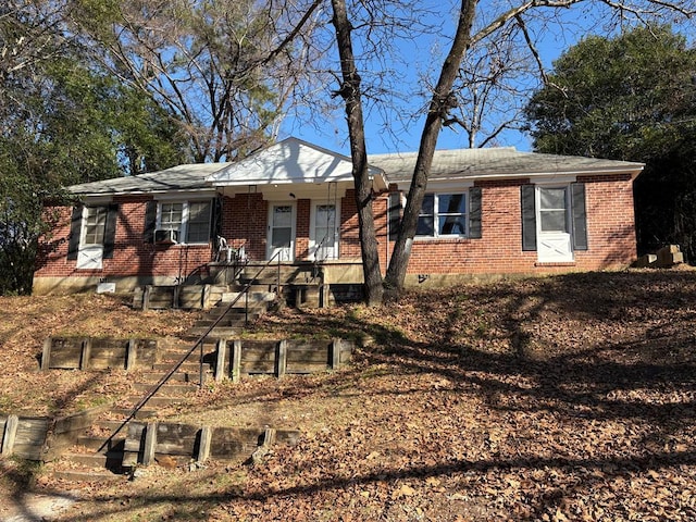 ranch-style house with covered porch