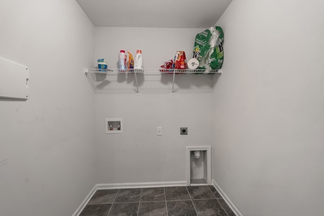 clothes washing area featuring washer hookup, a textured ceiling, and hookup for an electric dryer