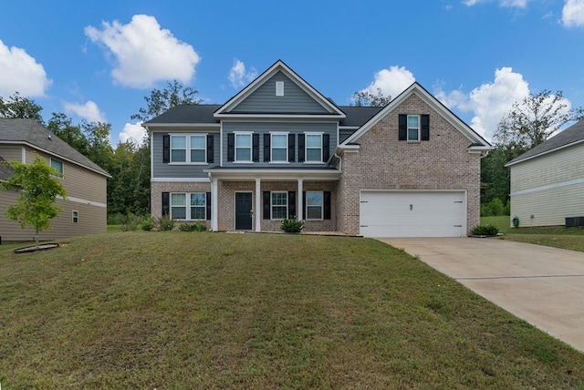 view of front of house featuring a front lawn and a garage