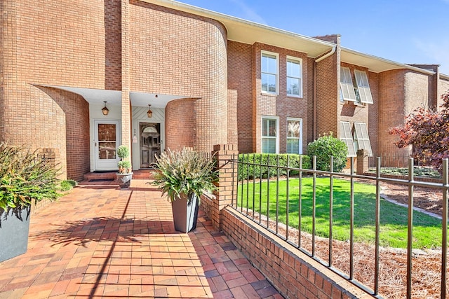 exterior space with a front lawn and covered porch