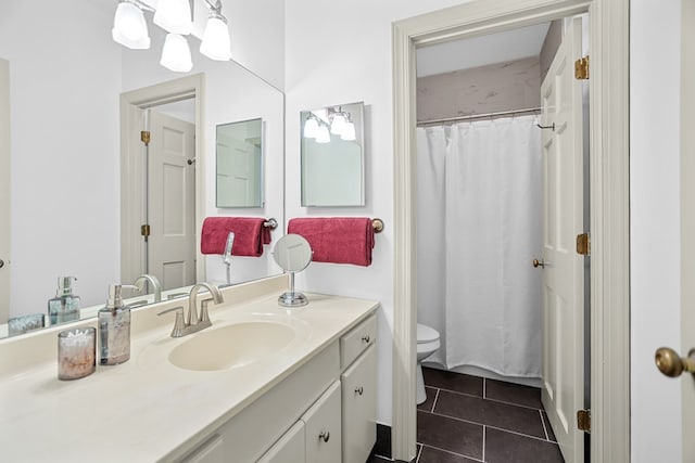 bathroom featuring tile patterned floors, a shower with curtain, vanity, and toilet