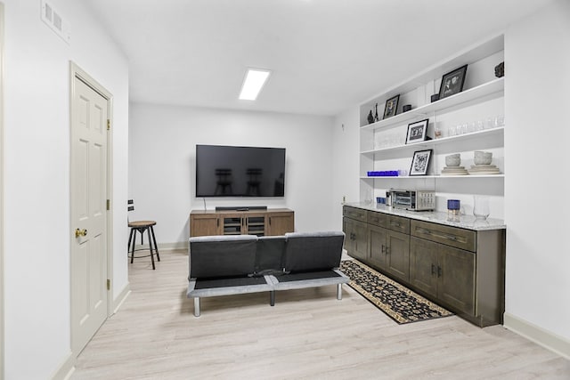 living room with light hardwood / wood-style flooring