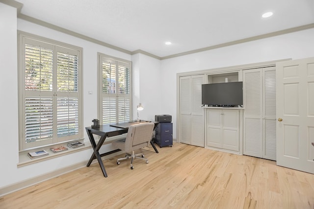 home office featuring light hardwood / wood-style floors and ornamental molding