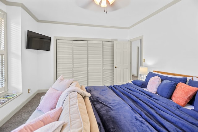 bedroom with carpet floors, a closet, ceiling fan, and ornamental molding