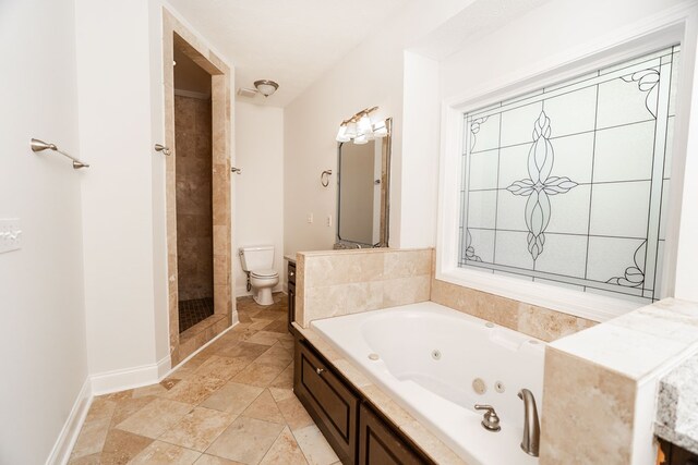 144 Lee Road 2083, Phenix City, AL 36870 - full bath featuring toilet, a whirlpool tub, a stall shower, stone finish floors, and baseboards