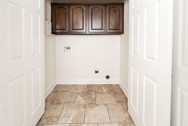 144 Lee Road 2083, Phenix City, AL 36870 - washroom featuring cabinet space, hookup for a washing machine, baseboards, electric dryer hookup, and light stone finish flooring