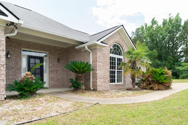 144 Lee Road 2083, Phenix City, AL 36870 - view of side of property featuring brick siding and a shingled roof