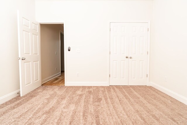 144 Lee Road 2083, Phenix City, AL 36870 - unfurnished bedroom with carpet, baseboards, and a closet
