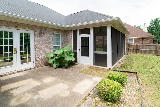 144 Lee Road 2083, Phenix City, AL 36870 - property entrance with french doors, a patio area, brick siding, and roof with shingles